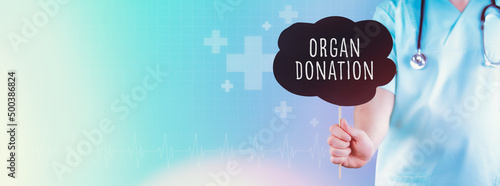 Organ Donation. Doctor holding sign. Text is in speech bubble. Blue background with icons photo