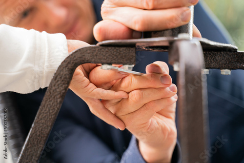 dad and son make repairs with a wrench