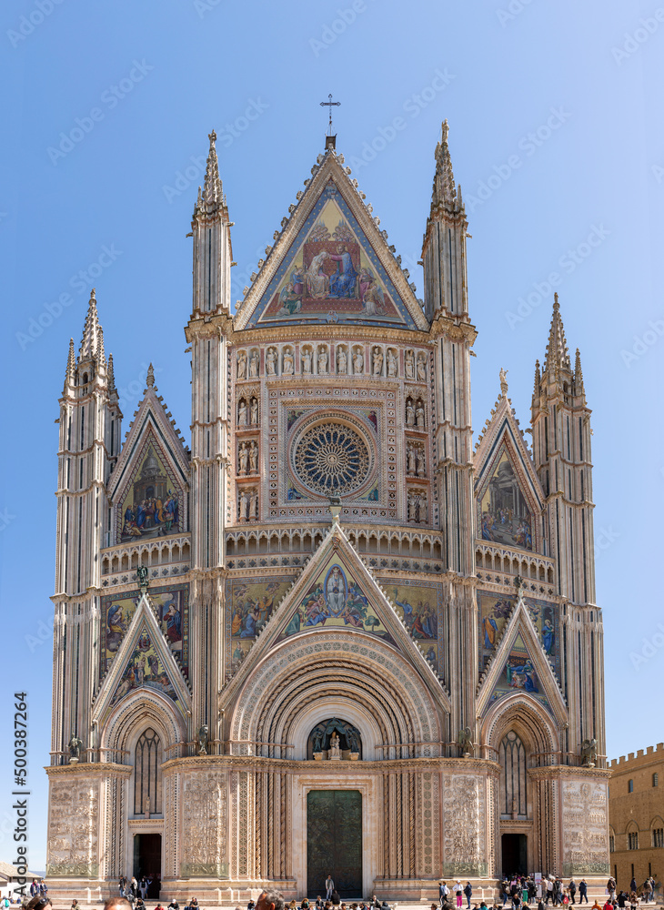 Orvieto, Umbria Italy: April 18, 2022: Famous cathedral Santa Maria Assunta made of mosaic scenes from the bible about the central square of the old city Orvieto, Duomo di Orvieto ,Terni province
