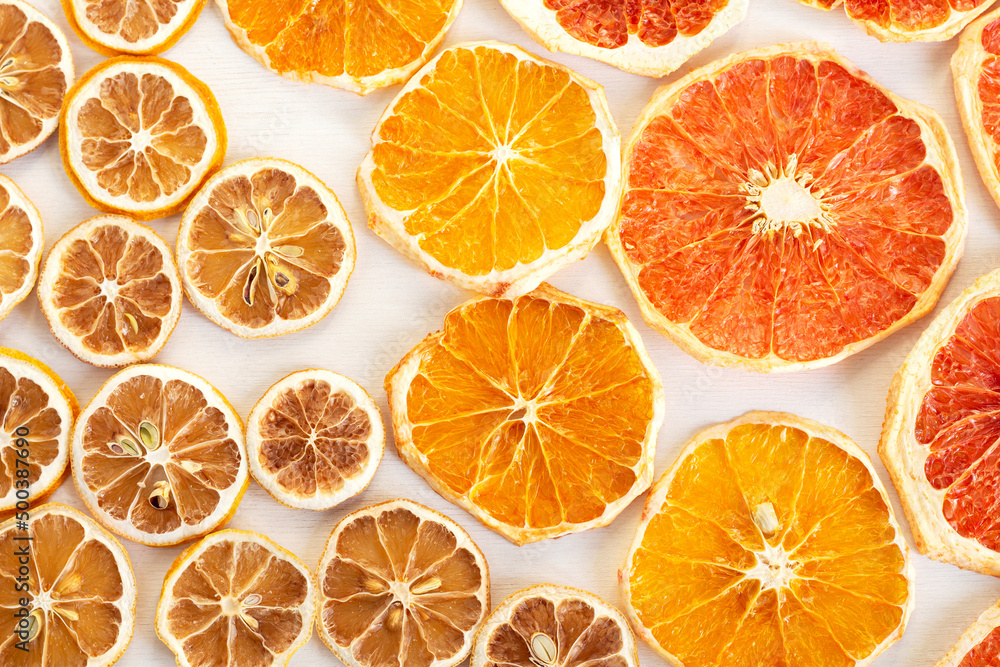 Dried slices of citrus fruits. Lemons, oranges, grapefruits. Colorful background Dried slices of citrus fruits. Lemons, oranges, grapefruits. Colorful background