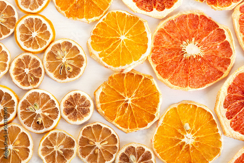 Dried slices of citrus fruits. Lemons, oranges, grapefruits. Colorful background