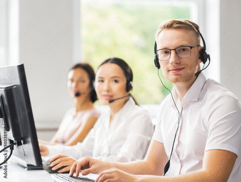 Team of professional support staff working in the office. Colleagues in the workplace solve customer problems. Call center and customer support concept. Team of professional support staff working in the office. Colleagues in the workplace solve customer problems. Call center and customer support concept.
