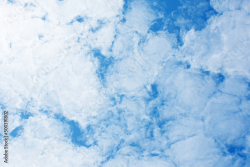 Blue sky scenery with white fluffy clouds for the background.