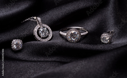 amazing silver set with diamonds on a black background © Tkachenkoproduction