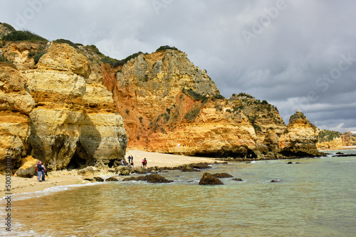 cliff and rocks and the beach of Praia do Camilo, in Lagos, Algarve, Portugal 