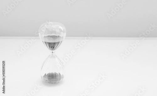 Hourglass, sandglass with sand on a white background