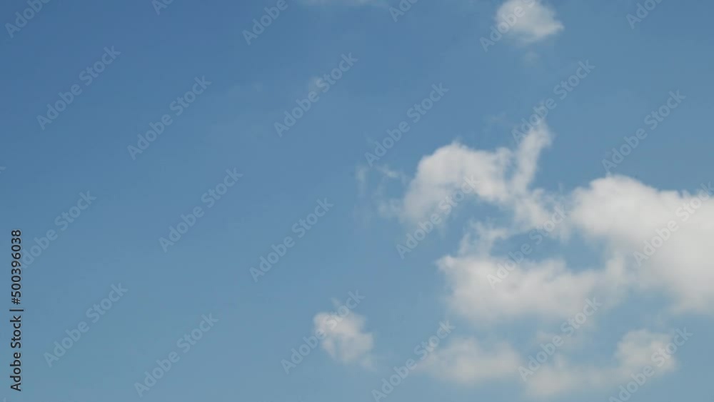 Sky cloud cotton blue clouds beautiful background outdoor moving cloud cluster swirling upward time-lapse . Cloud moving and transforming fast in the clear blue sky . Time lapse cloud beautiful sky Sky cloud cotton blue clouds beautiful background outdoor moving cloud cluster swirling upward time-lapse . Cloud moving and transforming fast in the clear blue sky . Time lapse cloud beautiful sky