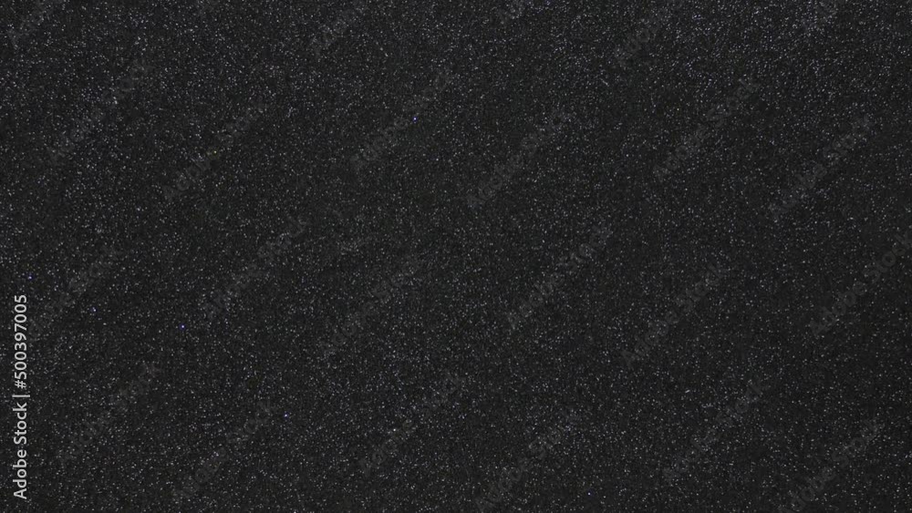 Monotonous black background in fine grain in motion from bottom to top Monotonous black background in fine grain in motion from bottom to top