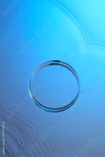 Top view of transparent podium and blank space in blue water background