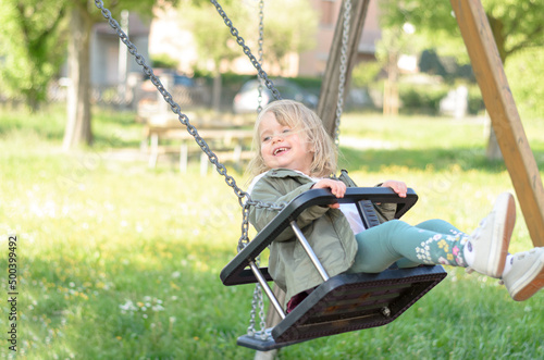 child on swing photo