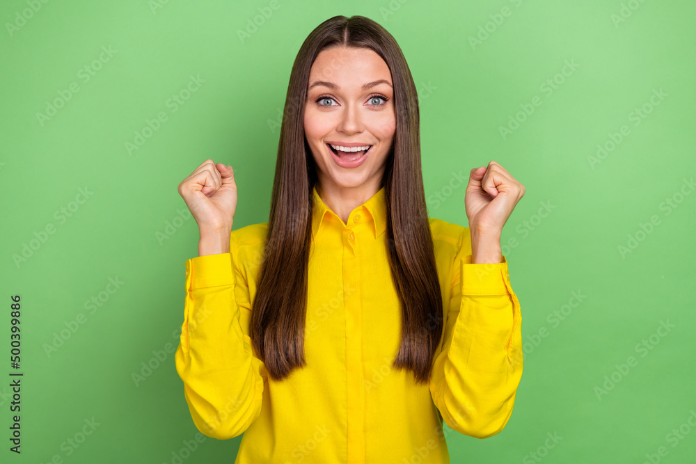 Photo of hooray young brown hairstyle lady yell wear yellow shirt isolated on green color background Photo of hooray young brown hairstyle lady yell wear yellow shirt isolated on green color background