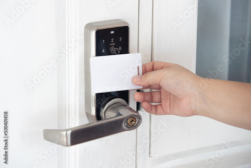 closeup people using contactless ID card scan door locker security system opening the door