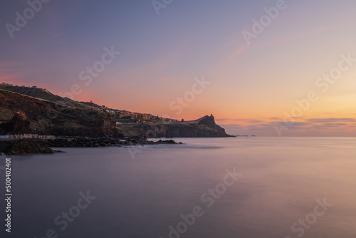 Coastline of Canico de Baixo and Reduto do Portinho rocks at sunrise. Madeira, october 2021. Long exposure picture