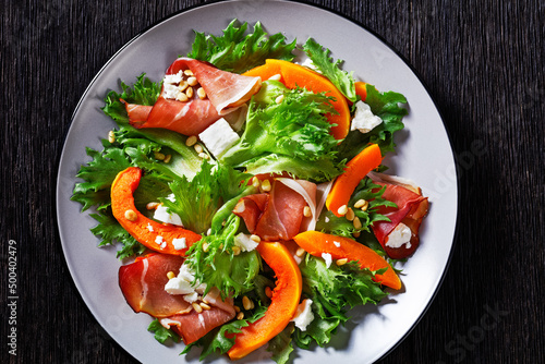 pumpkin salad with lettuce, crumbled cheese, ham