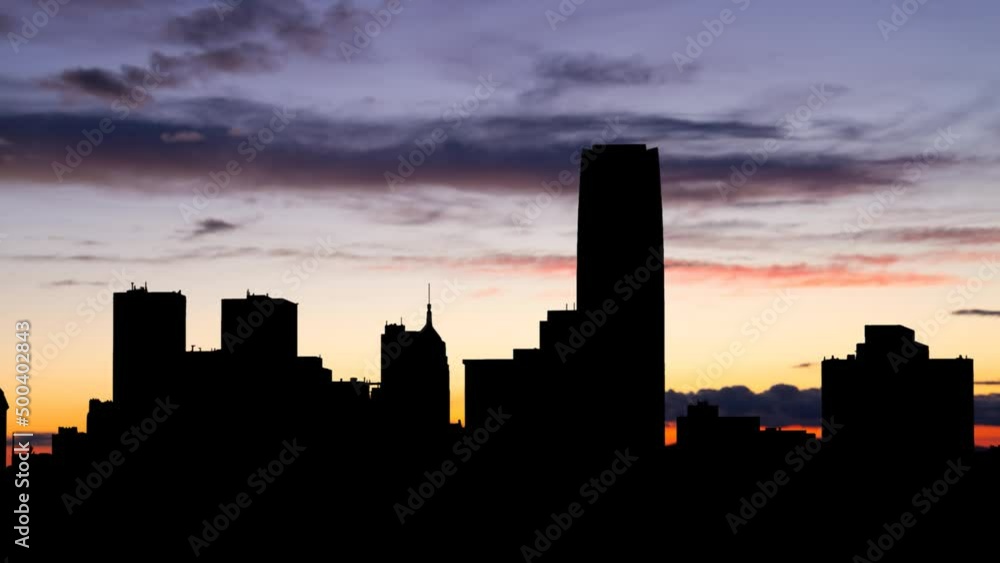 Oklahoma City: Time Lapse at Twilight with Colourful Sky and Dark Silhouette of downtown, USA Oklahoma City: Time Lapse at Twilight with Colourful Sky and Dark Silhouette of downtown, USA