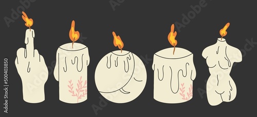 фотографія A set of modern burning candles of various shapes and colors