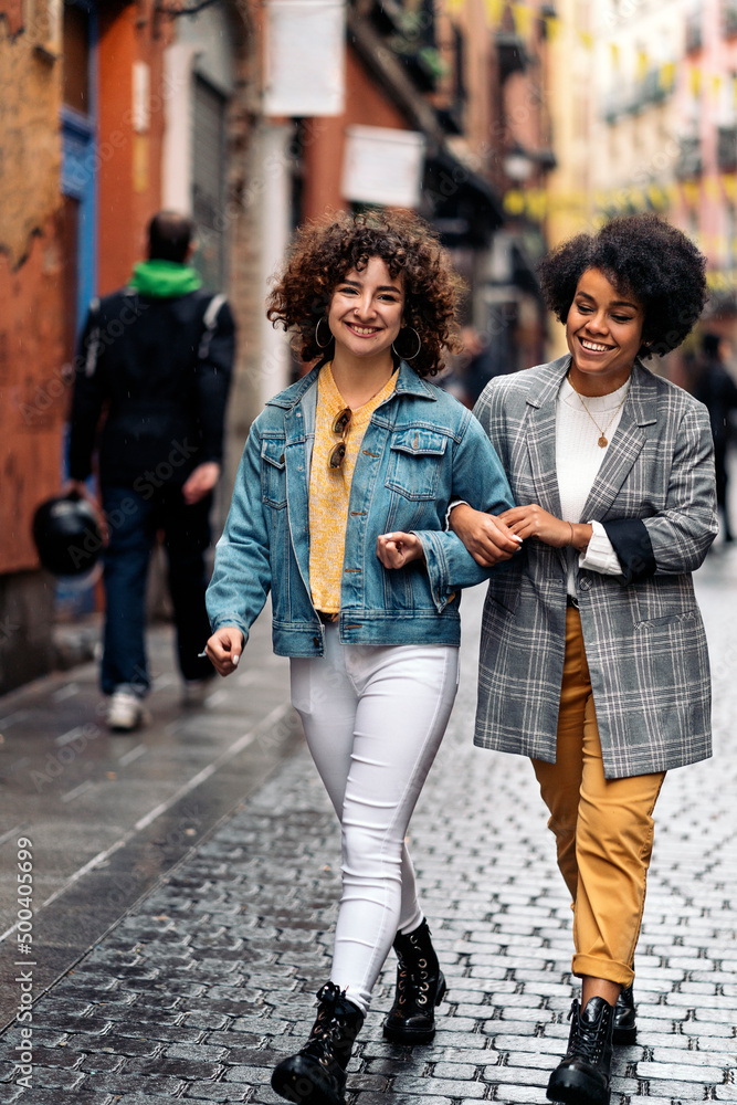 Fototapeta premium Friends Walking in Rainy Day