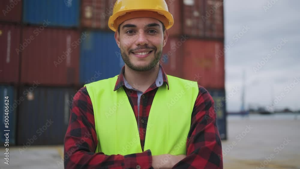 Happy young man working in logistic terminal of container cargo Happy young man working in logistic terminal of container cargo