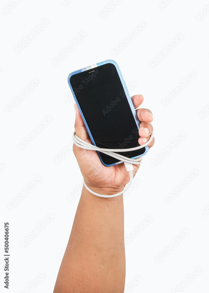 One hand of a man holding a smartphone wrapped by a charger cable.Social  Disease and smart phone addiction concept white background. isolated.with  clipping path Photos | Adobe Stock