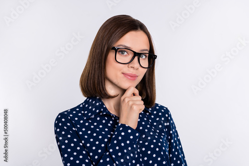 Portrait of attractive minded cheery skilled brown-haired girl expert thinking isolated over gray pastel color background