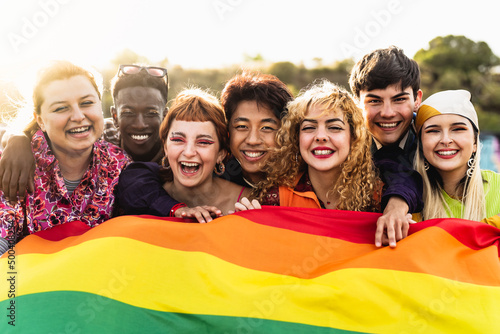 Diverse young friends celebrating gay pride festival - LGBTQ community concept photo