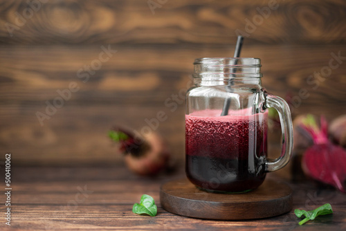 vegetable smoothie with spinach and red beets in a glass mug