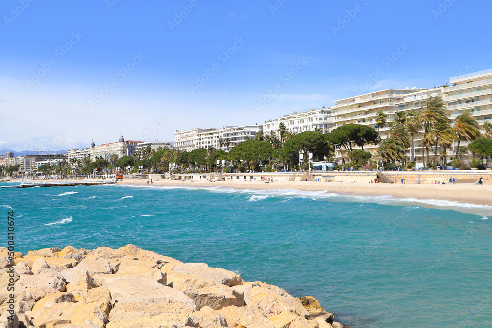 The beach, beach promenade and the town Cannes - France The beach, beach promenade and the town Cannes - France
