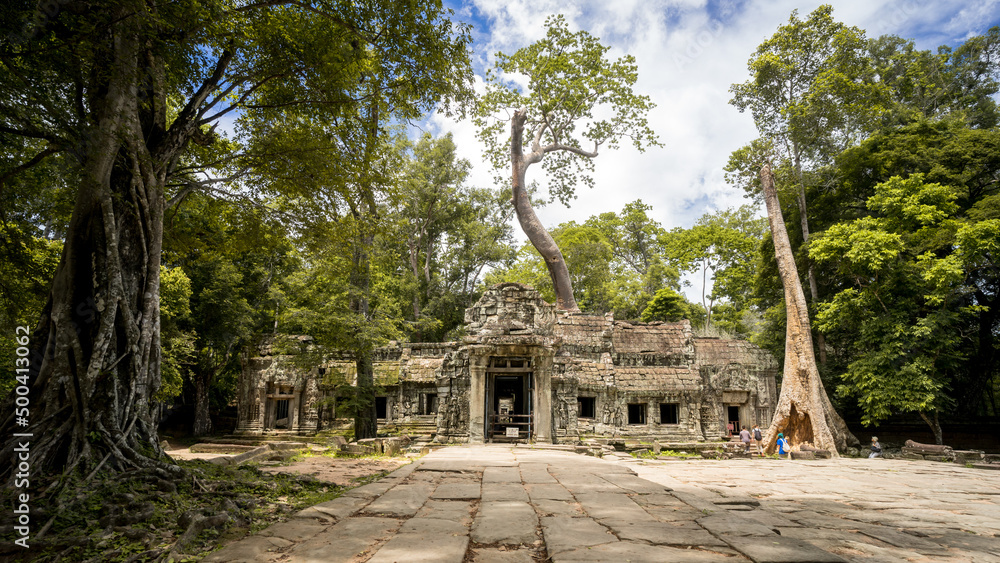 Ruin of Ta Prohm Temple near Angkor Wat. Seedlings of strangler figs or tetrameles trees grew with passage of time and slowly threatened to crush the very foundation that once supported them. Ruin of Ta Prohm Temple near Angkor Wat. Seedlings of strangler figs or tetrameles trees grew with passage of time and slowly threatened to crush the very foundation that once supported them.