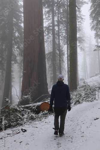 man walking in the snow