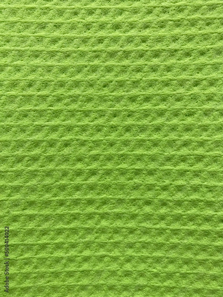 a light green surface with a uniform pattern a light green surface with a uniform pattern