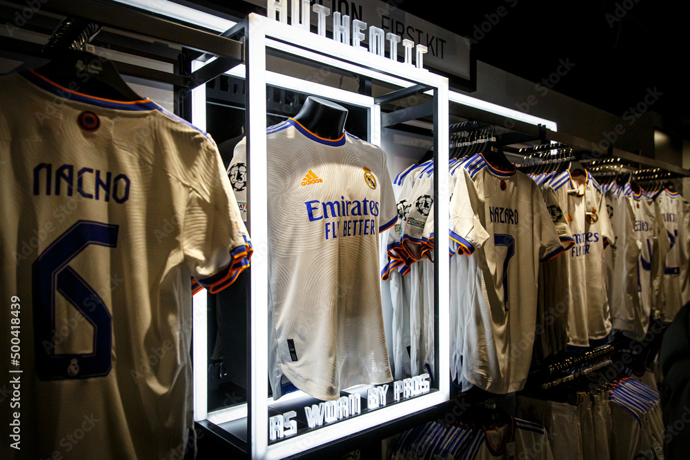 Real Madrid kit in the fan shop. Club store with team shirts. Stock Photo |  Adobe Stock