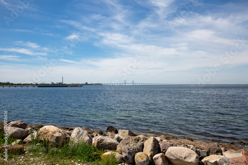Fototapeta Naklejka Na Ścianę i Meble -  View of the Baltic Sea from Ribersborg beach with Oresund Bridge on the horizon, Malmo, Sweden
