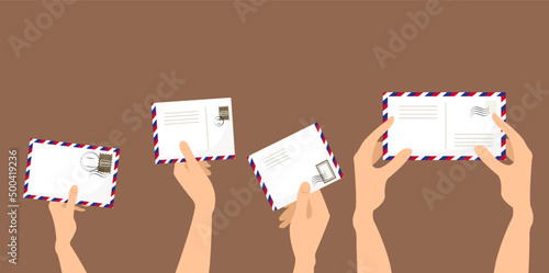 hand holding a letter envelope to send 