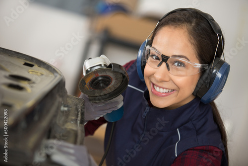 coachbuilding taining girl standing in garage