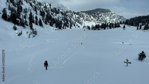 group of mountaineers trekking in winter and amazing views in the mountains