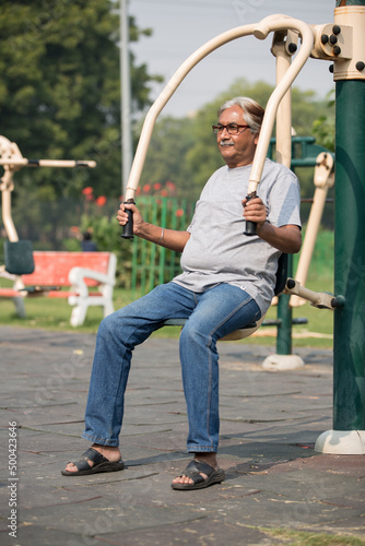 Photography Indian senior man doing exercise at public park