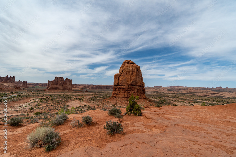 Arches National Park at Midday - Arches has many arches including the famous Delicate Arch, the Window Arch, the Double Arch and other features such as Tower of Babel, Turret Arch, and the Courthouse Arches National Park at Midday - Arches has many arches including the famous Delicate Arch, the Window Arch, the Double Arch and other features such as Tower of Babel, Turret Arch, and the Courthouse