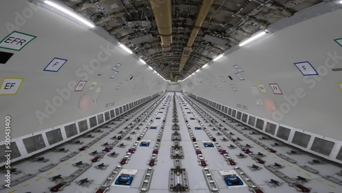 Cargo Airplane - walk inside the main deck cargo compartment on a freshly converted wide-body freighter aircraft, all windows  are removed and the loading system installed photo