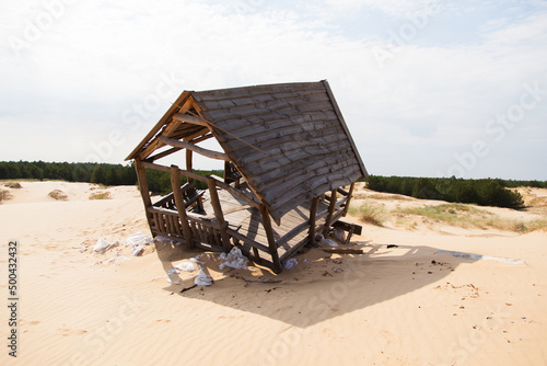 Wooden house destroyed by a sandstorm.