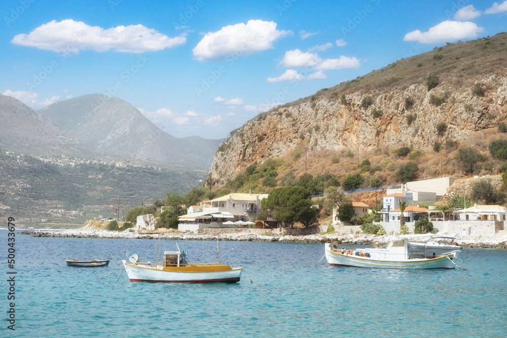 The cosmopolitan town of Porto Heli, Peloponnese, Greece, with a blue domed church and turquoise sea