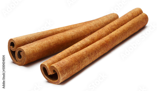 Two cinnamon sticks, isolated on white background