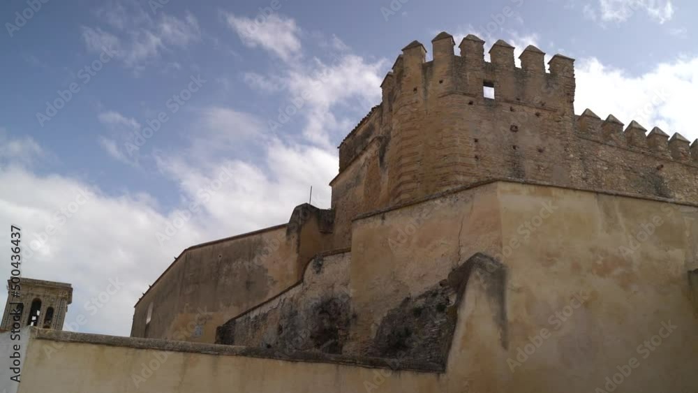 Slow tilt up reveal over old castle walls in typical European architecture style Slow tilt up reveal over old castle walls in typical European architecture style