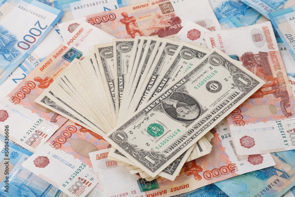 One US Dollar on Russian ruble. Money background. Currency exhange. Economic crisis. Rouble dollar cash. Hundred dollar bill and 5000 rubles. Business and finance. Russia and USA One US Dollar on Russian ruble. Money background. Currency exhange. Economic crisis. Rouble dollar cash. Hundred dollar bill and 5000 rubles. Business and finance. Russia and USA
