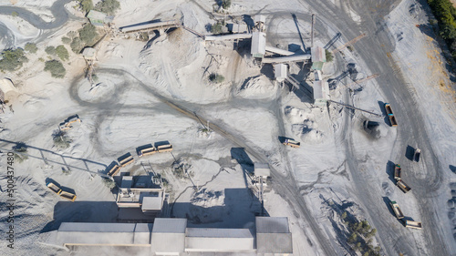 Aerial view cement plant and ready mix concrete, Plant for the production of cement and dry mortar for the construction industry, Crushing the stones for the cement production. © Kalyakan