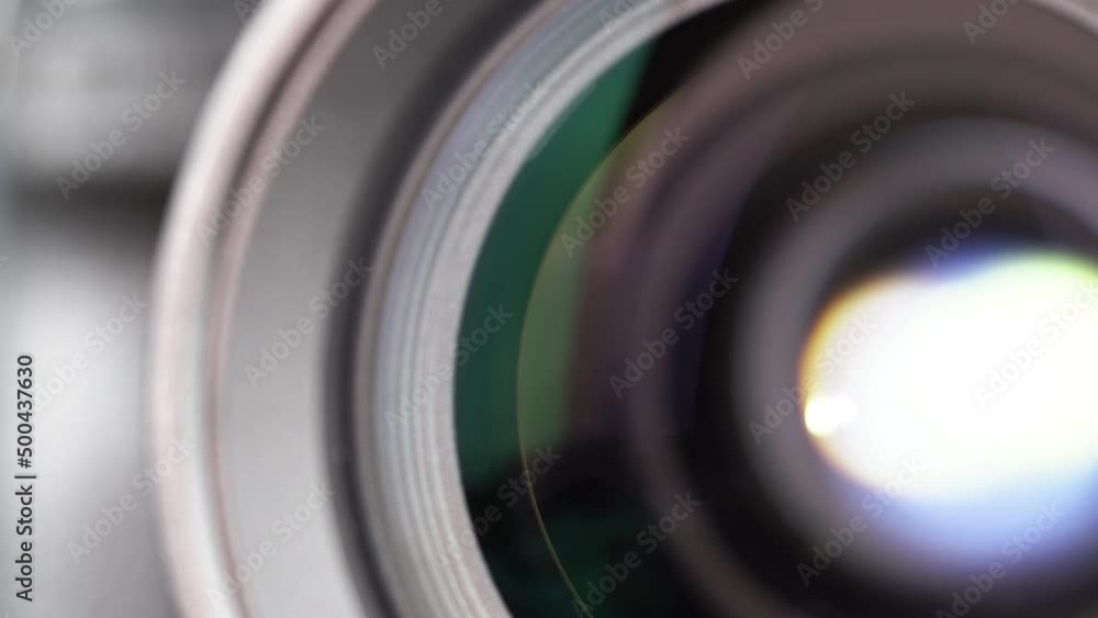 Macro Shot of Camera Lens with Flare on Optical Glass. Process of Zooming Camera Lens Macro Shot of Camera Lens with Flare on Optical Glass. Process of Zooming Camera Lens