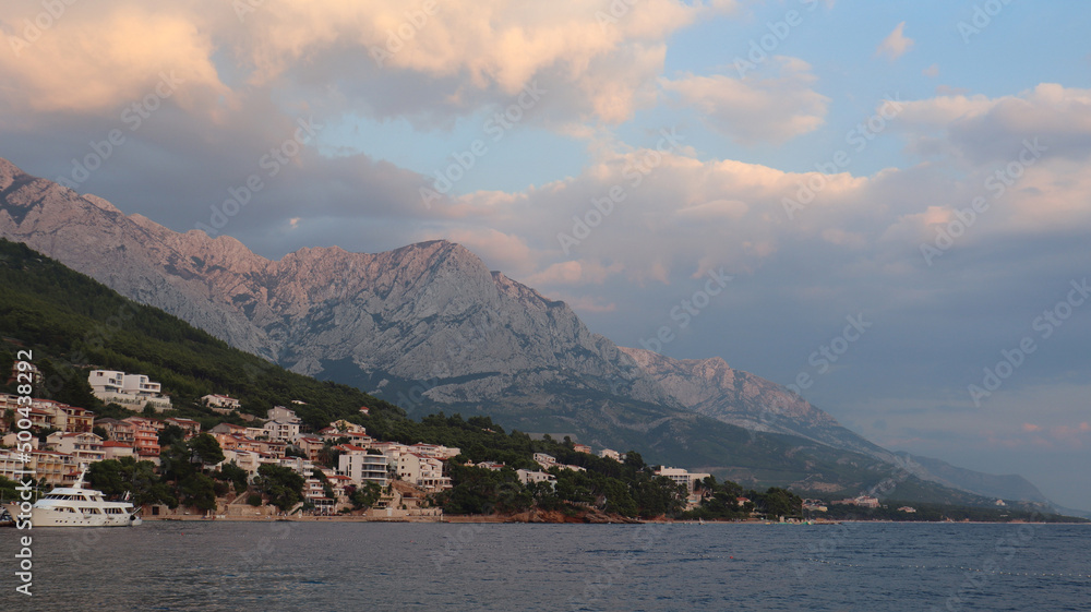 The resort village  Brela, Croatia on the Adriatic Sea, view from the sea on a summer evening