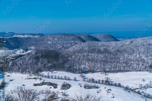Germany, Breitenstein aerial panorama view on swabian alb mountains in winter wonderland season, covered with snow, a beautiful scene © Simon