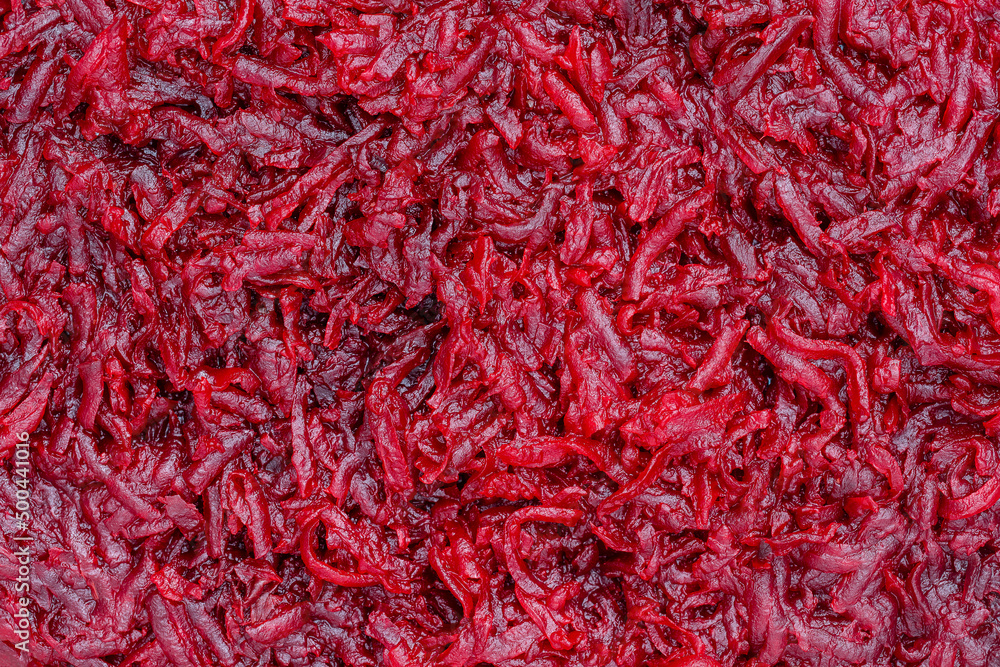 Background and texture of raw fresh grated red beetroot vegetable Background and texture of raw fresh grated red beetroot vegetable