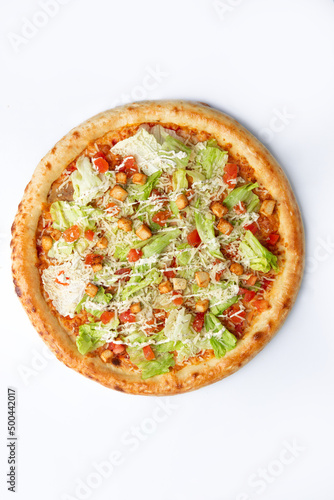 Big pizza with greens. On a white background.