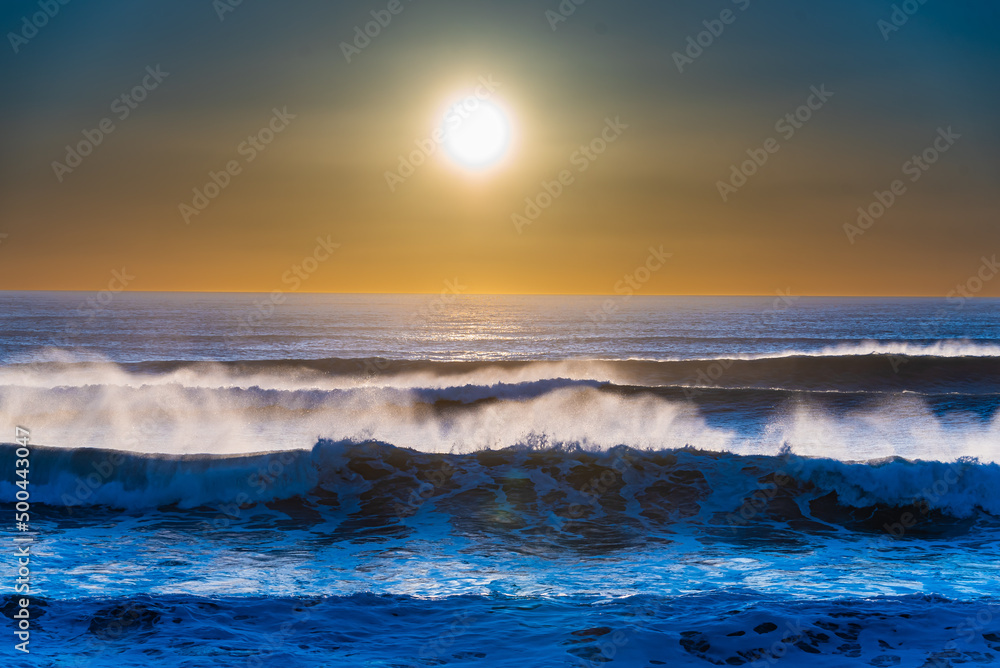 wave spray and sunset
